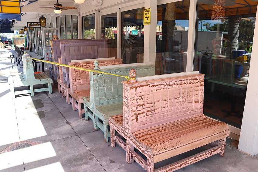 Booths at Cha Cha Coconuts restaurant have been moved to the sidewalk while restoration takes place inside.
