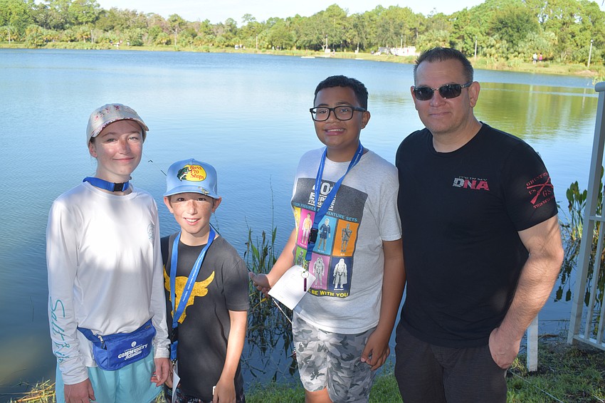 Parrish's 13-year-old Allison Raia and 11-year-old Liam Raia and Lakewood Ranch 13-year-old Brayden Sharp and David Sharp find a spot to themselves on Lake Uihlein to fish. Brayden Sharp caught a 15-inch fish.