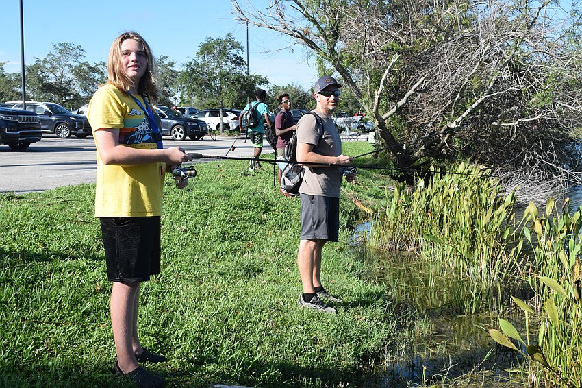 Lakewood Ranch 13-year-old Brady LaPalme fishes with his dad, Darren LaPalme. They were lucky and caught a fish before the tournament started but hadn't had much luck an hour into the tournament.
