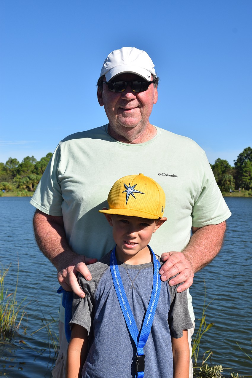 Lakewood Ranch's Jack DeLeon sits back and watches his 8-year-old grandson Taylor Miller, who is visiting from St. Petersburg, try to catch a fish. 
