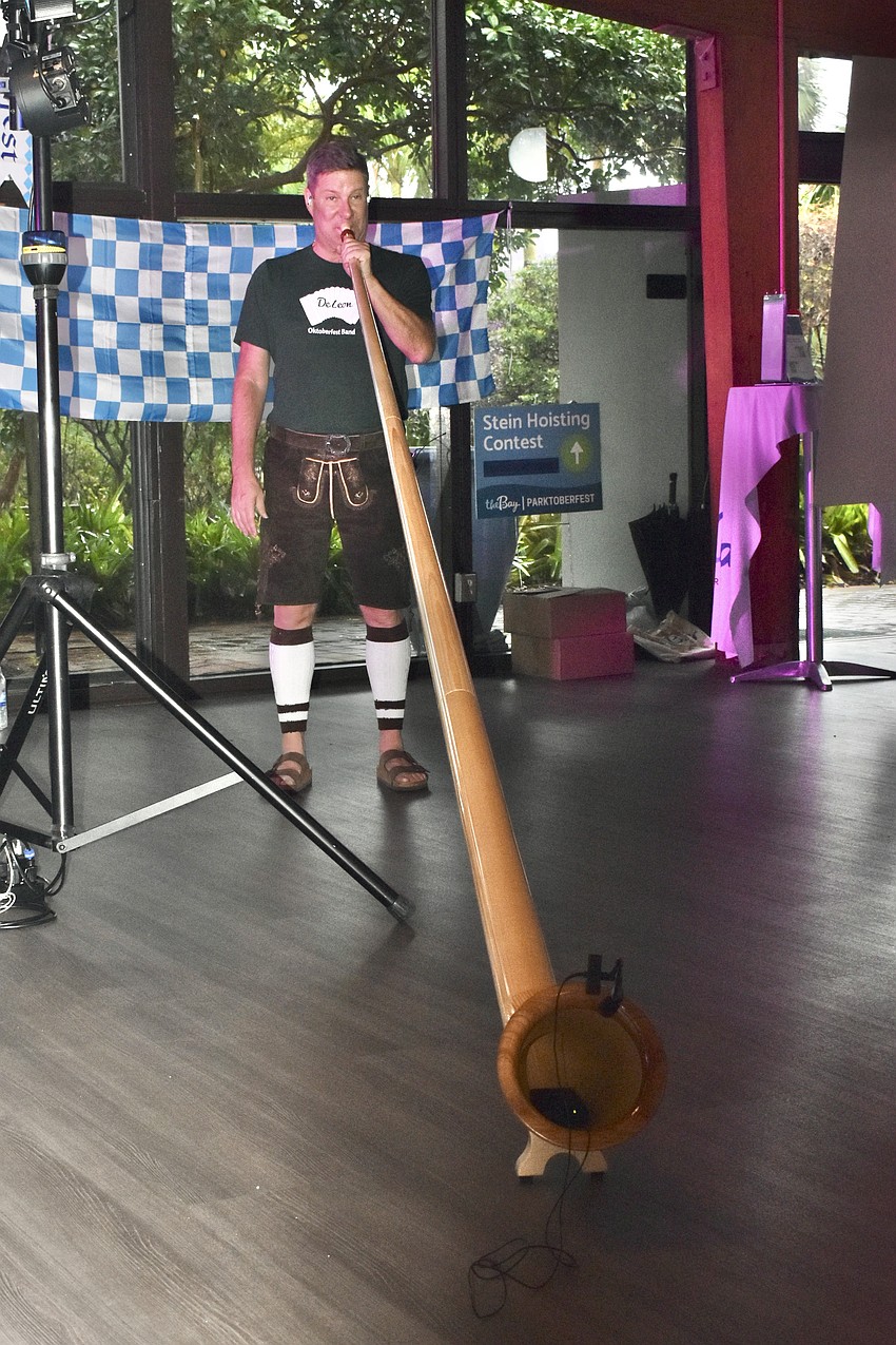 Jeff Wooldridge of the DeLeon Oktoberfest Band plays the alphorn.