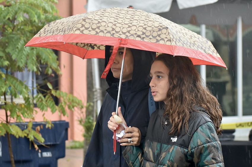 Johana Kuermerle and Timothy Kuermerle, 13, weren't deterred by the rain.