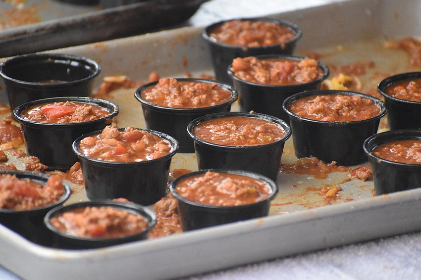 Cups of chili await enjoyment by guests.
