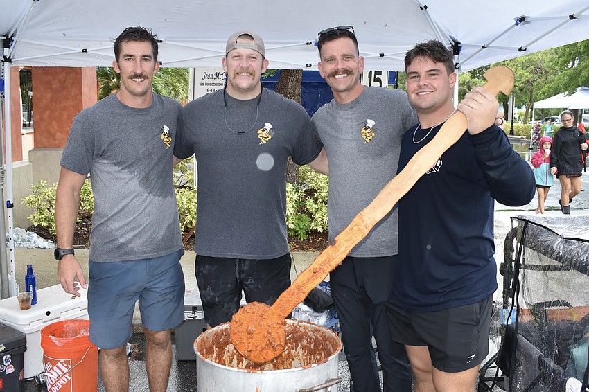 Keith Misja, Mike Matheis, Stephen Dickmann and Kaleb Smith of Station 12, prepare a pot of chili.