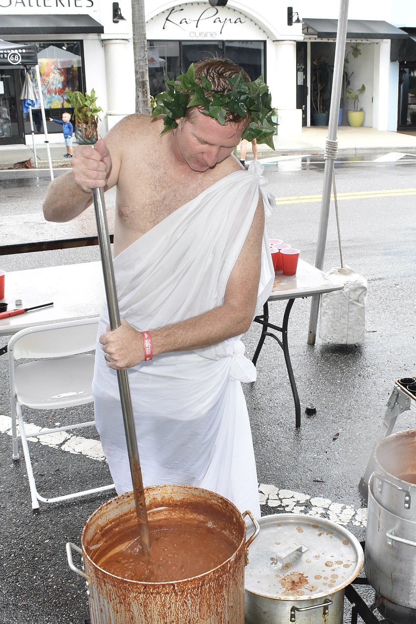 Darren Lally of Station 5 stirs a pot of chili.