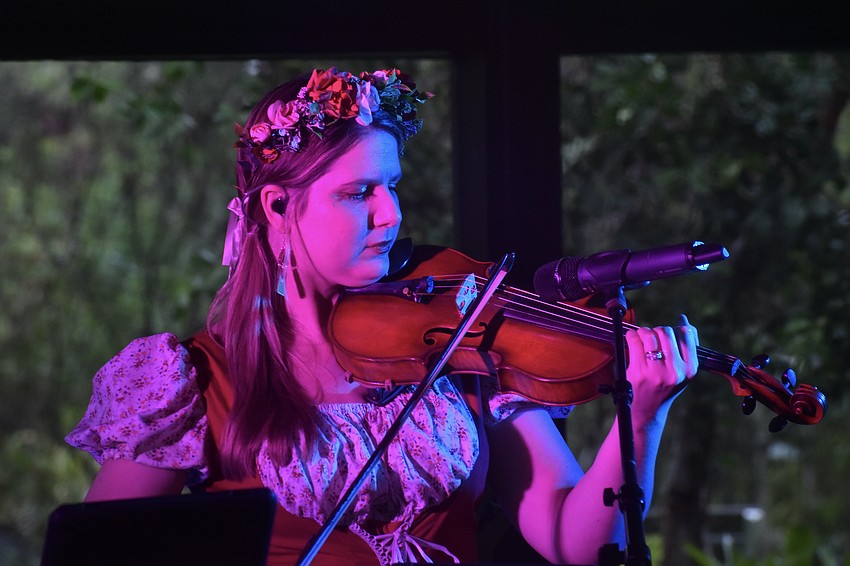 Haley DeLeon of the DeLeon Oktoberfest Band plays the violin.