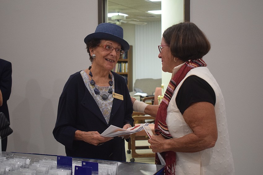 Barbara Pressman greeting Judy Tobias at the Rosh Hashanah service at Temple Beth Israel.