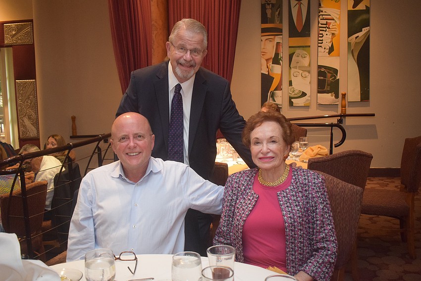 Craig and Joyce Cooper with Rabbi Stephen Sniderman at the Rosh Hashanah luncheon.