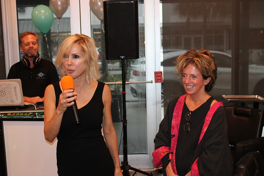 Sirius Day Spa owner Karen Medford thanks Stephanie Peabody, the founder and executive director of the Brain Health Initiative, for her support of Sirius over the years.