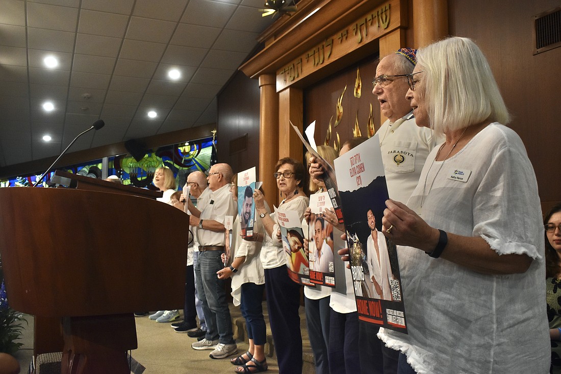 Members of the congregation sing "The People Israel Lives."