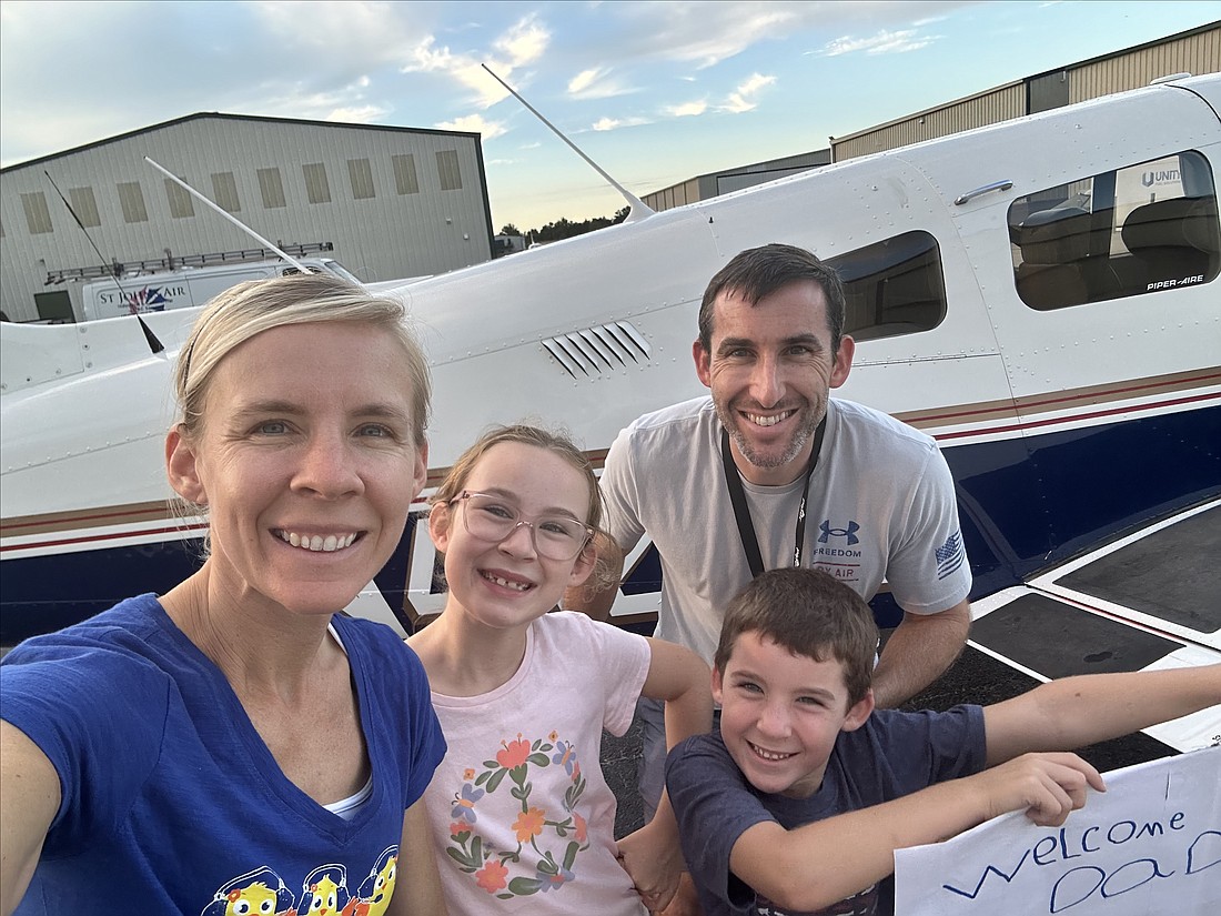 Stephanie, left, Madison, Brady and Corbin Clouser captured a family photo following the completion of the supply delivery.