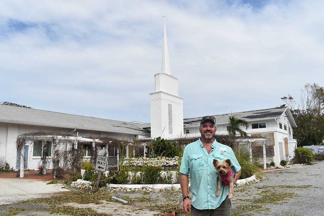 Brock Patterson, senior pastor at Longboat Island Chapel, and his dog Pippa