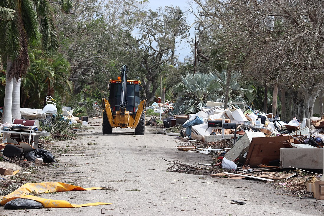 Debris remained a problem down many Longboat Key streets after Hurricane Milton.