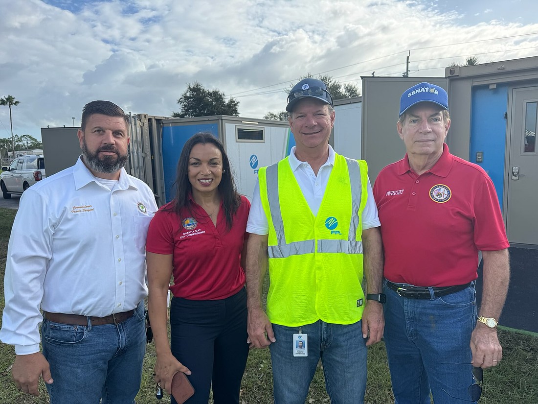 Ormond Beach Commissioner Travis Sargent, Daytona Beach Commissioner Quanita May, Florida Power & Light CEO Armando Pimentel and State Sen. Tom Wright. Courtesy photo