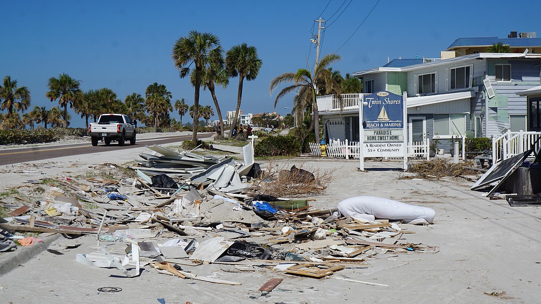 Debris piled out outside of the Twin Shores community.