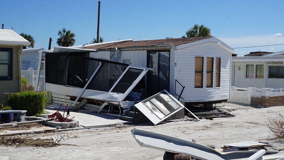 A partially-dilapidated home in the Twin Shores community on Longboat Key after Hurricane Milton.