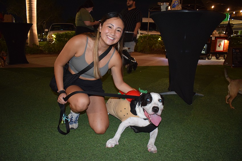 Sarasota's Suzy Lobodiak brings her dog Zeus dressed as a hot dog to Barks and Boos. Lobodiak says the hot dog costume spoke to her.
