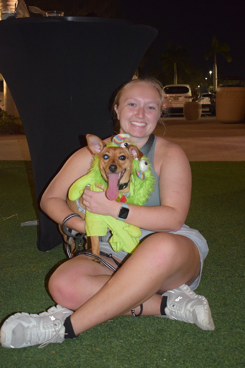 Sarasota's Madison Feys dresses her dog Poppi as a monster. 