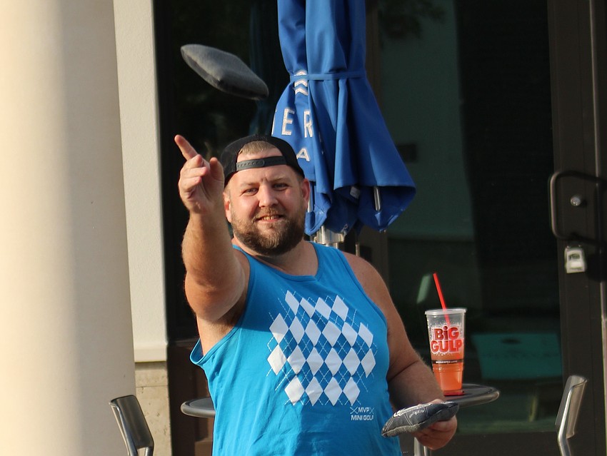 East County's Branden Cooper takes dead aim during cornhole league play on Wednesday at Ranch Nite Wednesdays.
