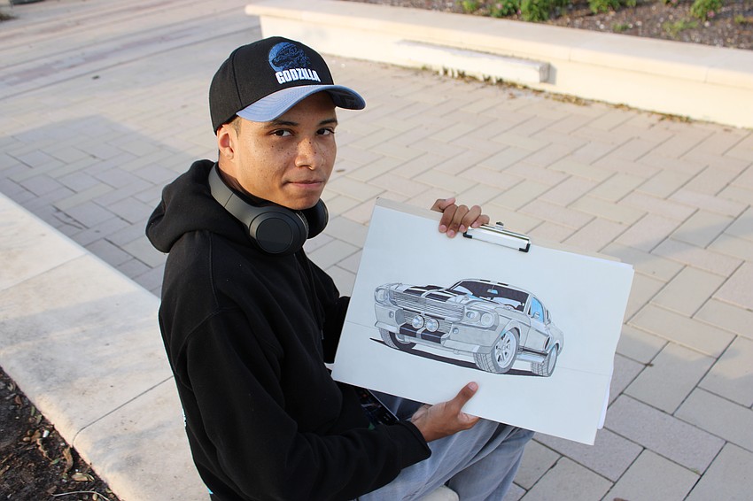 Waterside's Eric Cade shows off his artistic talent during Ranch Nite Wednesdays at Waterside Place. Cade specializes in automotive art.
