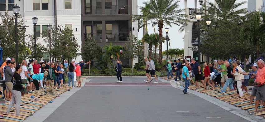 Cornhole bags filled the air along Lakefront Drive in Waterside Place as the regular cornhole league was back in action during Ranch Nite Wednesdays.