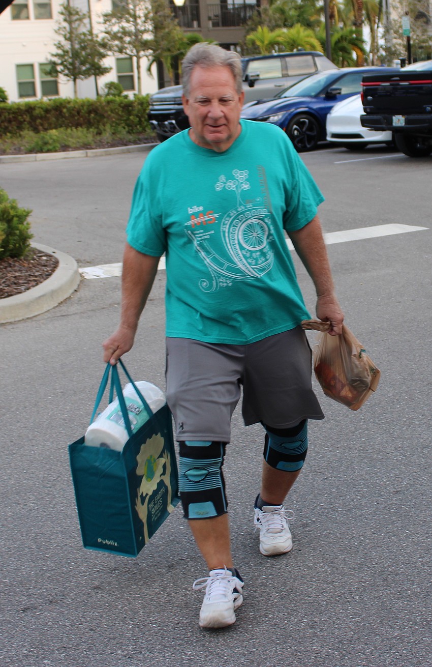 Central Park's Mike Krighbaum drops off donations during Ranch Nite Wednesdays at Waterside Place.