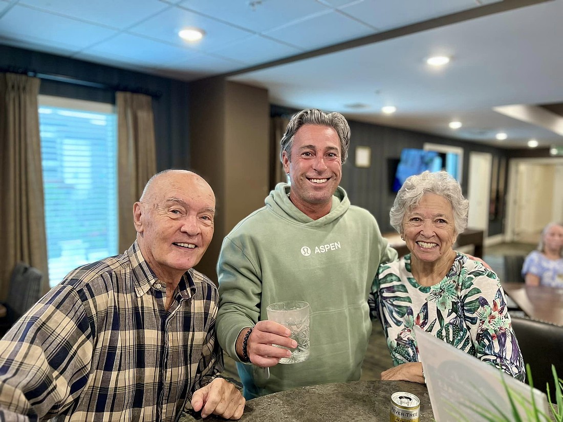 President and CEO of Atlas Senior Living Scott Goldberg (center) was in the upstairs sports bar area at The Goldton during Hurricane Milton.