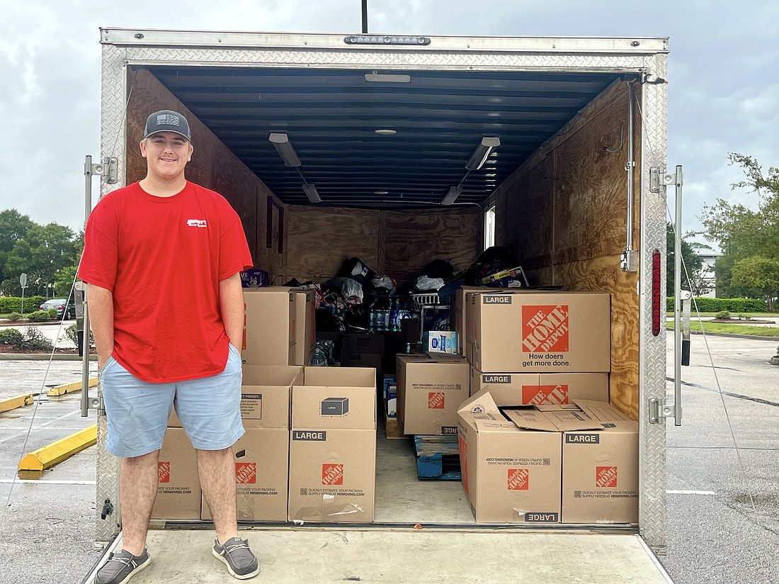 Logan Malone collected supplies for hurricane victims in his racecar trailer and delivered them to an Operation Airdrop site in North Carolina. Photo by Bruce Blazer and Remmika Battles