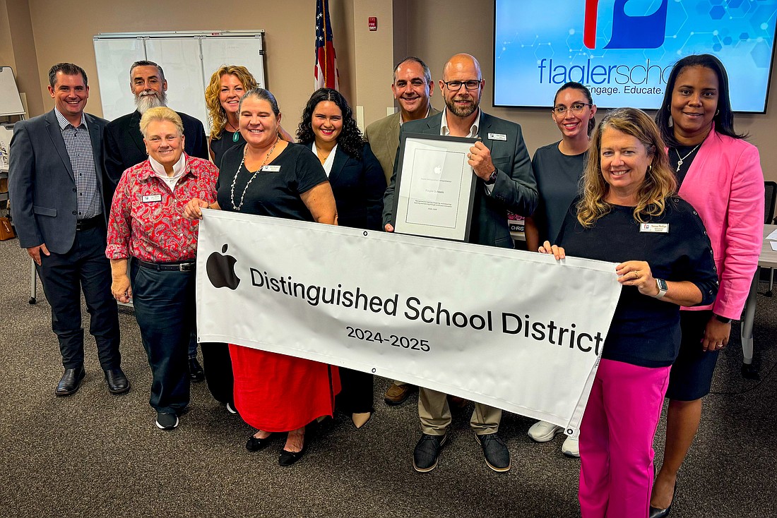 Flagler Schools is honored as an Apple Distinguished School District at the Oct. 14 School Board meeting. Courtesy photo