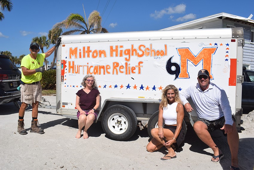 Tom Lopes, Julie Swanger, Sharon Austin and Tony Berube unloaded supplies collected by Milton High School on Oct. 22.