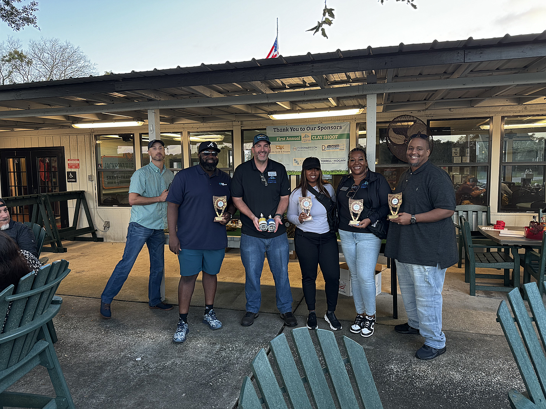 From left, Bradley Bodiford, Keith Blue, Shawn Devries, Ashley Goggins, Latoya Williams-Shelton and Vernon Shelton received the “Most Honest” team award at the Jacksonville Area Legal Aid Clay Shoot Fundraiser to Drive Justice Forward.