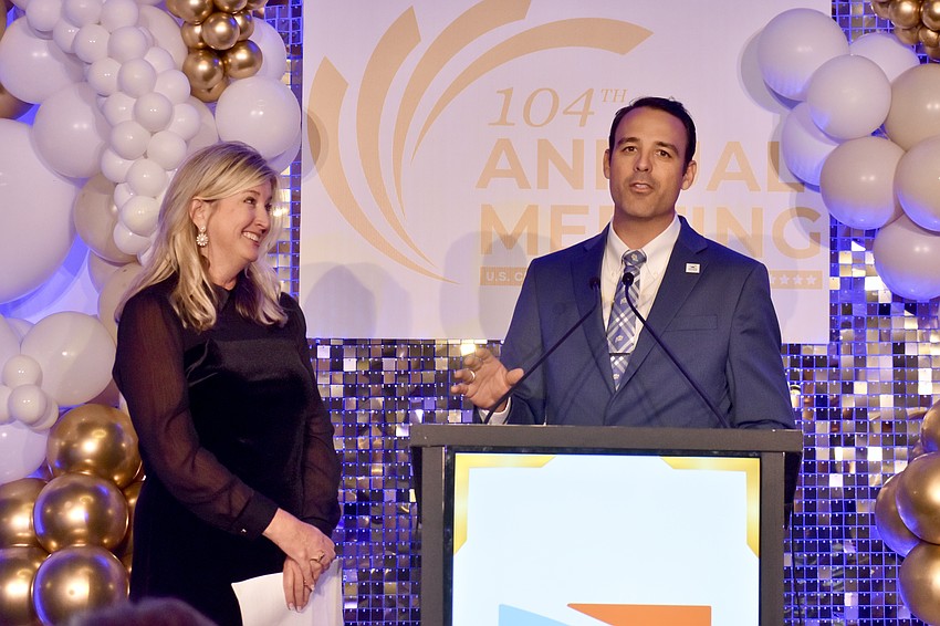 Sarasota Chamber president Heather Kasten receives recognition for her work from chair Joe Hembree.