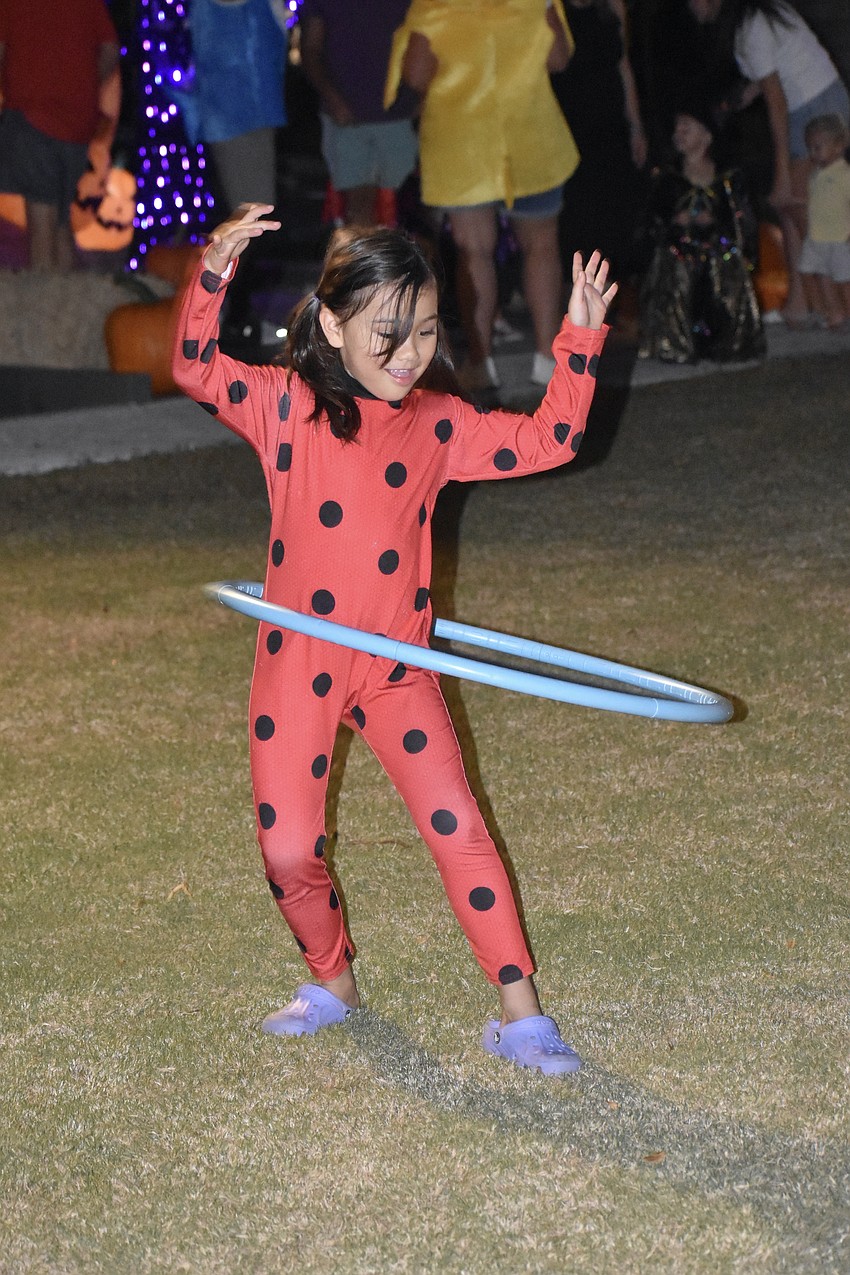 Lily Reusch, 6, practices her hula hooping skills.