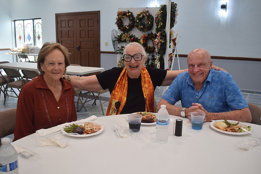 Cindy Noble, Sheila Nemes and George Noble at the St. Mary Star of the Sea potluck.