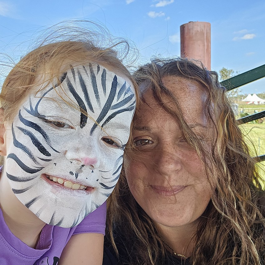 Tabytha Burrill has fun with her mom Jess at Hunsader Farms Pumpkin Festival.