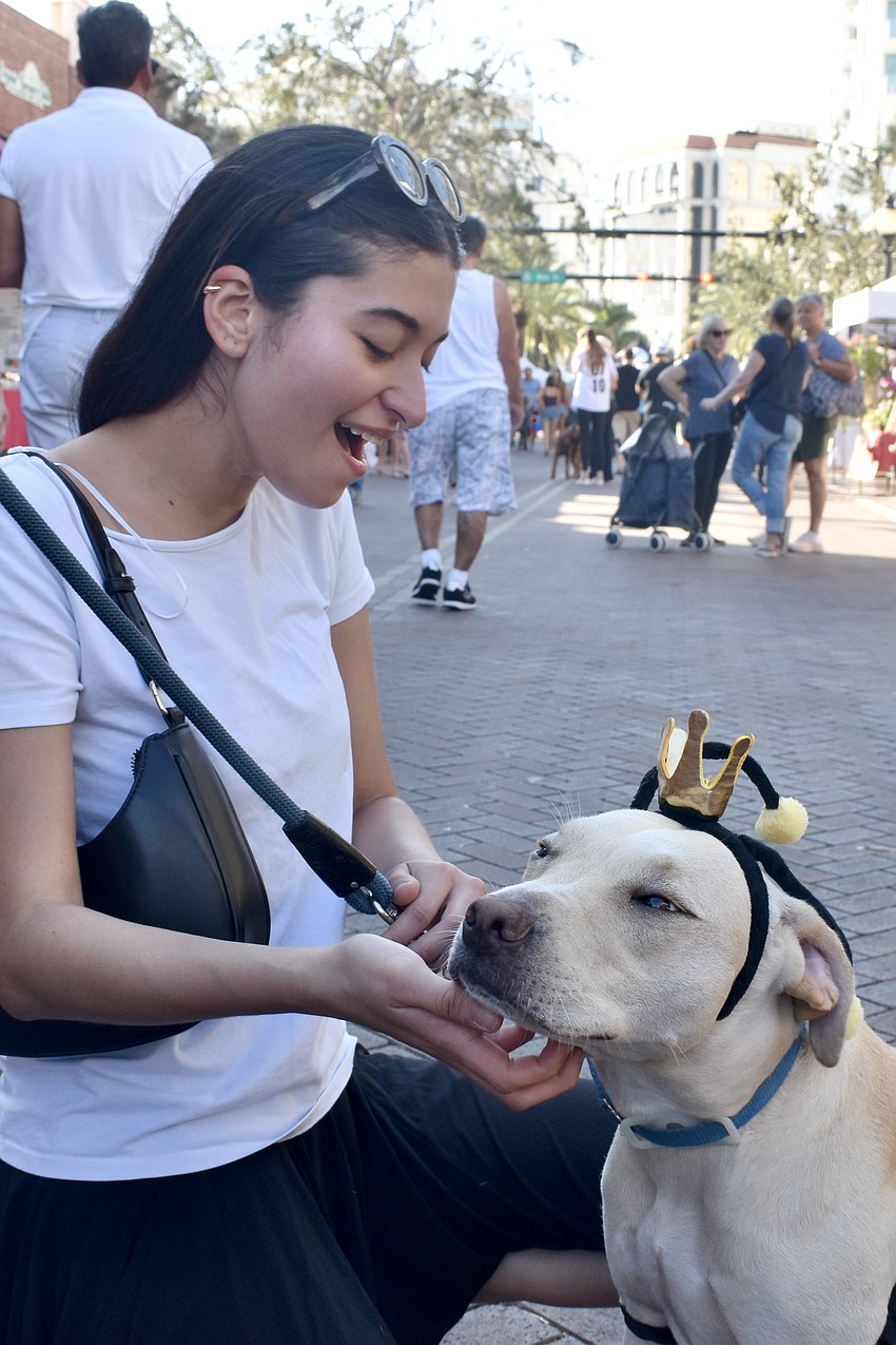 Valentina Labrera helps Teddy (who is dressed as a bee) prepare for the costume contest.