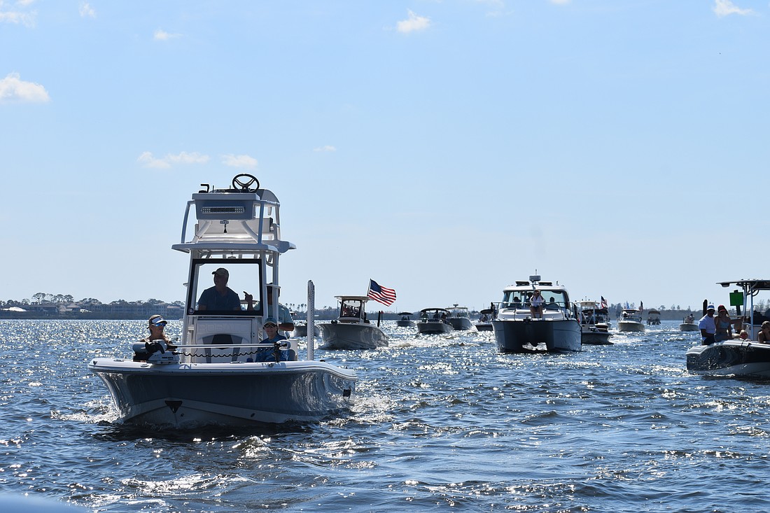 Boats make their way towards Midnight Pass.