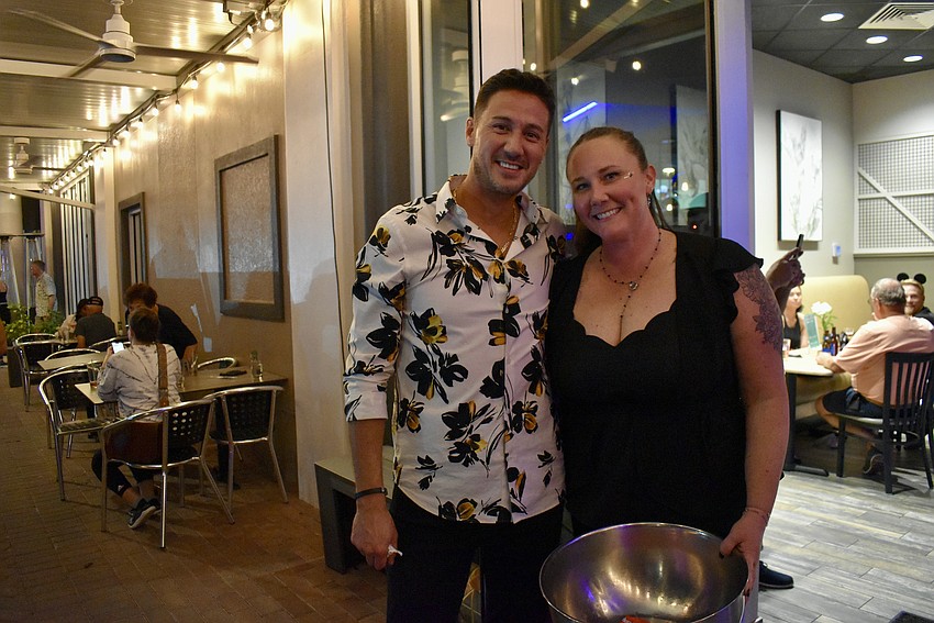 Robert Remington and Wendy Jones have passed out 20 pounds of candy at Remy's on Main so far and have another 10-pound bag waiting.