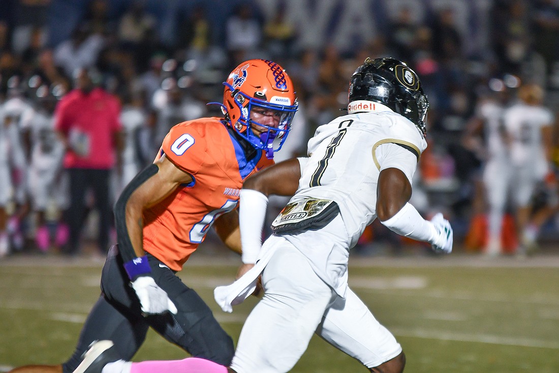 West Orange's Ivan Taylor (No. 0) and Ocoee's Joshua Guerrier (No. 1) lined up against each other during a punt.