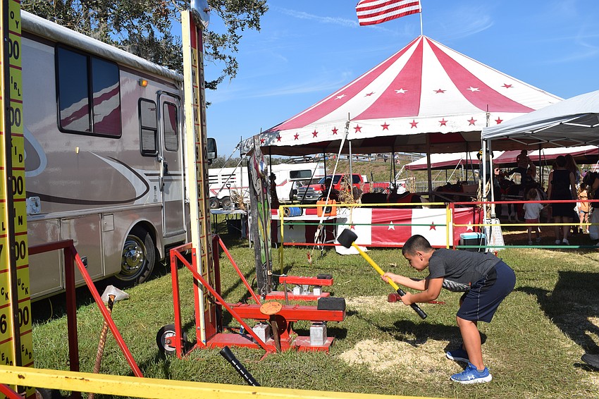 Sarasota 10-year-old Jaxson Colon gives it his all when slamming the hammer down.