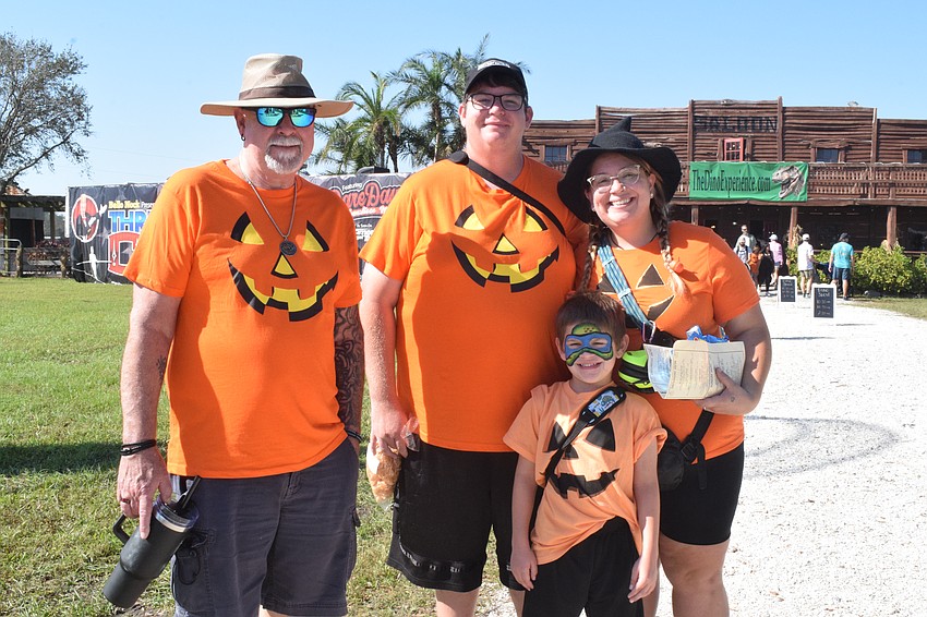 Matching outfits are a must for Bradenton's Tim Cloninger, James Winkles, 7-year-old Rogan Winkles and Mercedes Winkles. This year is matching pumpkin shirts.