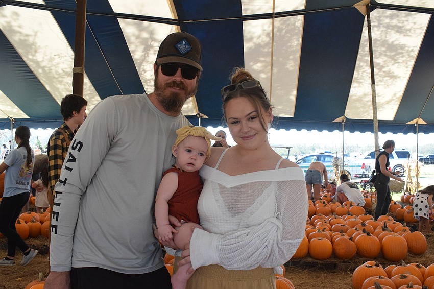 Lakewood Ranch's Chris Voigt and his 7-month-old daughter Freya Voigt and wife, Miya Voigt go the Hunsader Farms Pumpkin Festival for the first time. 