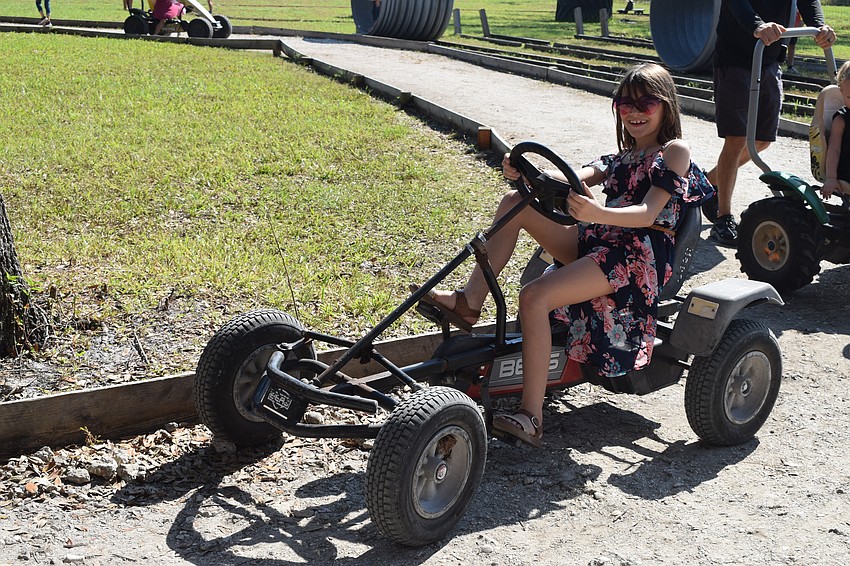 Bradenton 9-year-old Macie Gore races around a track.