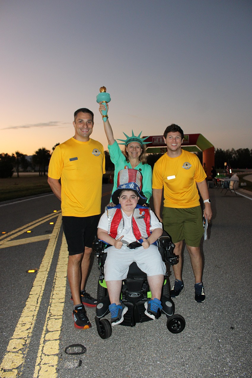 Boo Run assistant director Stephen Crescenti, Monika Oberer and Race Director Carl Albano join Grayson Tullio (front) before the fundraiser.