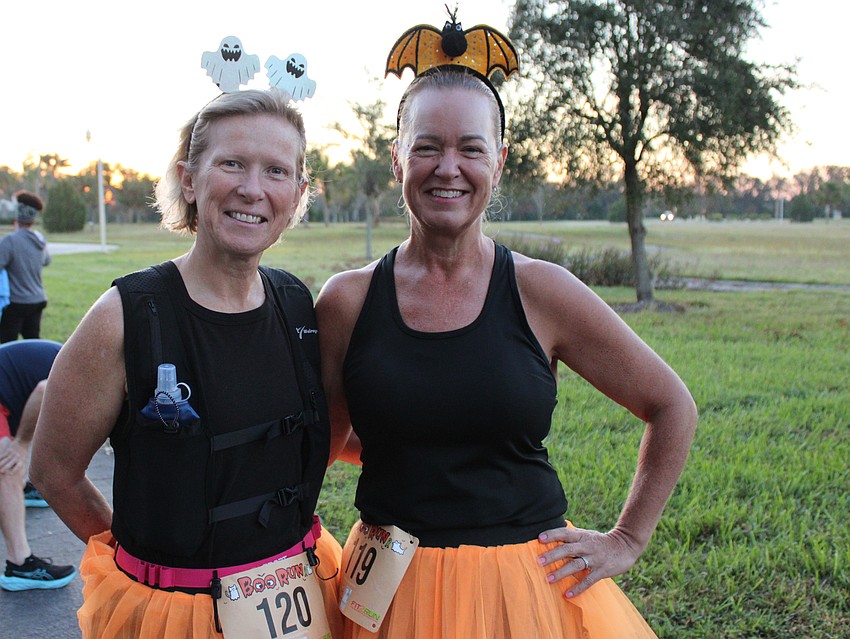 Parrish's Dawn Barnett and Lisa Morgan say they were looking for something fun to do, so they put on orange skirts and headed to the Boo Run.