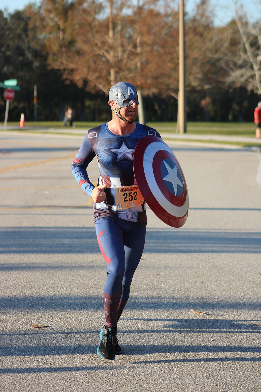 Captain America, also known as Jonathan Russell, runs to the rescue at the Boo Run.