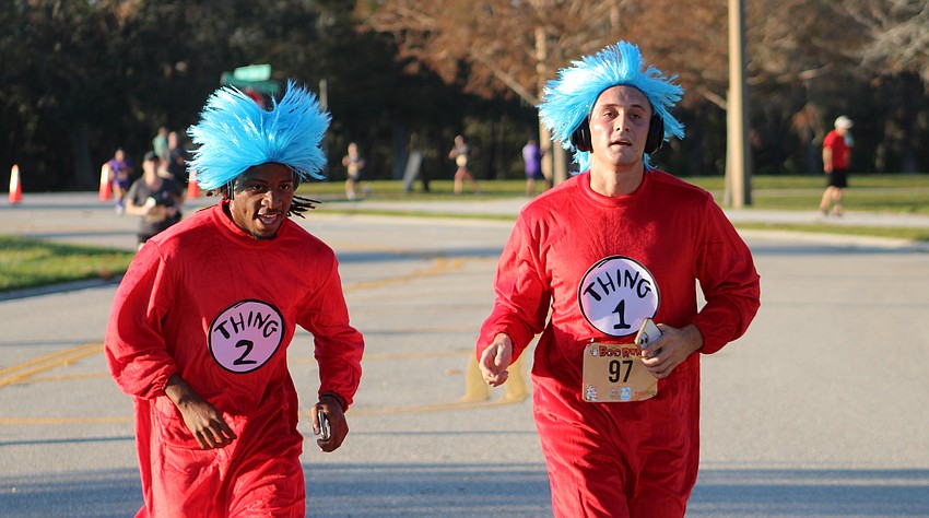 Bradenton's Jamarie Rutledge says his best friend Sammy Levita of the Inlets usually is the fastest Thing, but they hit the finish line of the Boo Run at the same time.