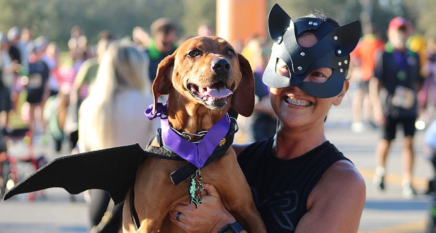 Lakewood Ranch batdog Ruby and Batwoman Rebekah Boudrie decided to hang around at the Boo Run.