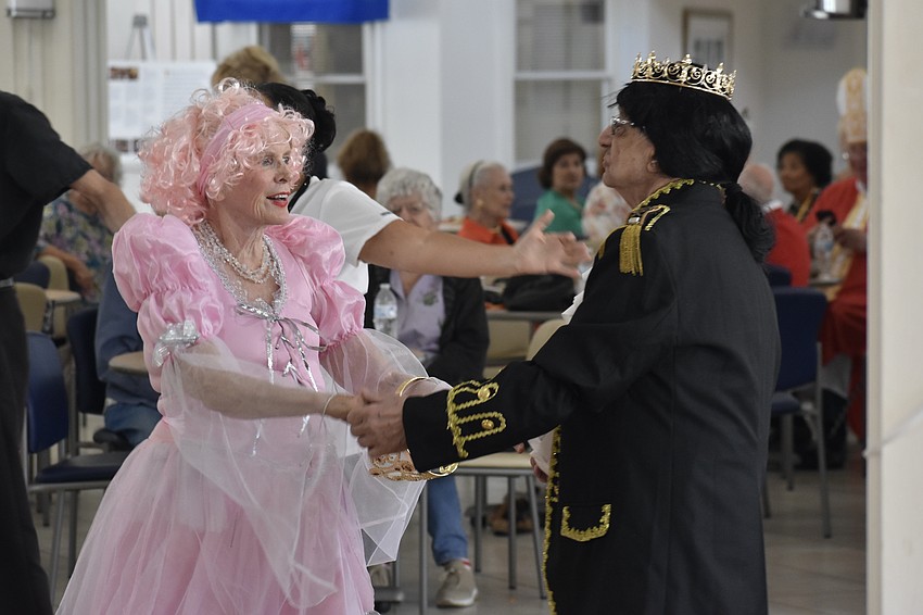 Lucille Pererva dances with her longtime friend Frank Cefola. The two enjoy matching their Halloween costumes each year.
