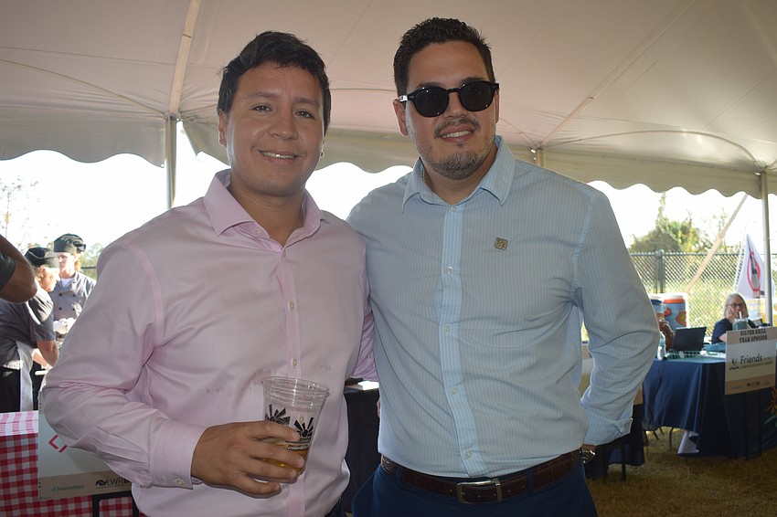 Bank OZK's Jose Lescano and Fifth Third Bank's Ernesto Izquierdo make connections at the Hob Nob, which had approximately 400 attendees.